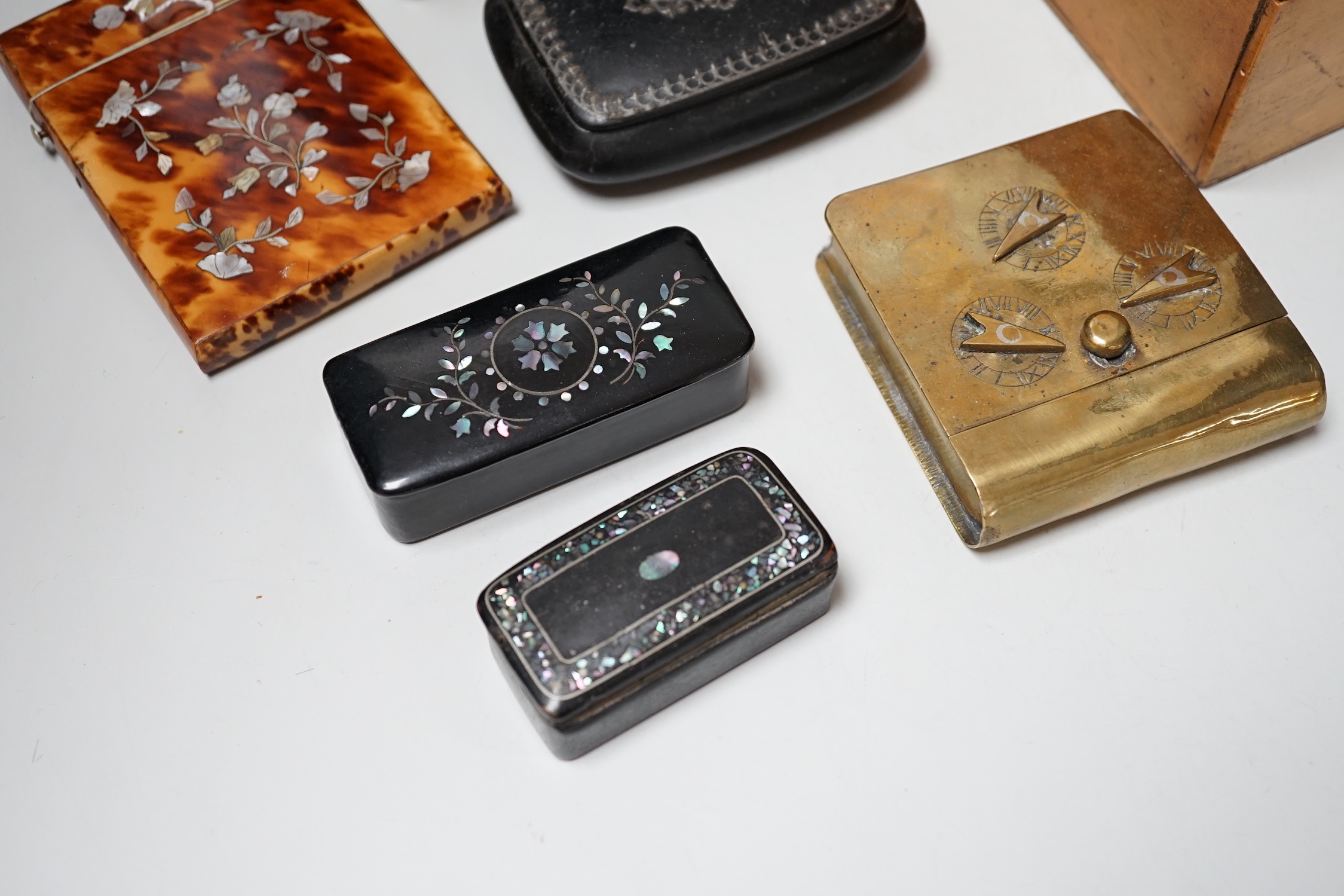 A Victorian Coromandel box containing a Victorian tortoiseshell mother-of-pearl inlaid card case, a Mauchline ware box and other boxes